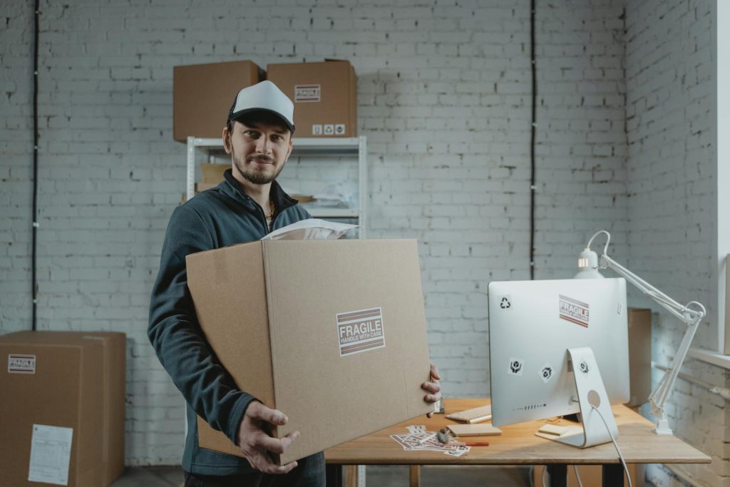 a man with a box of fragile equipment