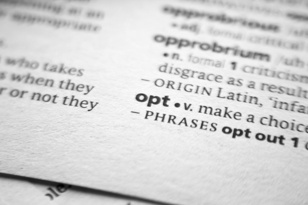 a picture of a dictionary, zoomed in on the word 'opt' and it's definition