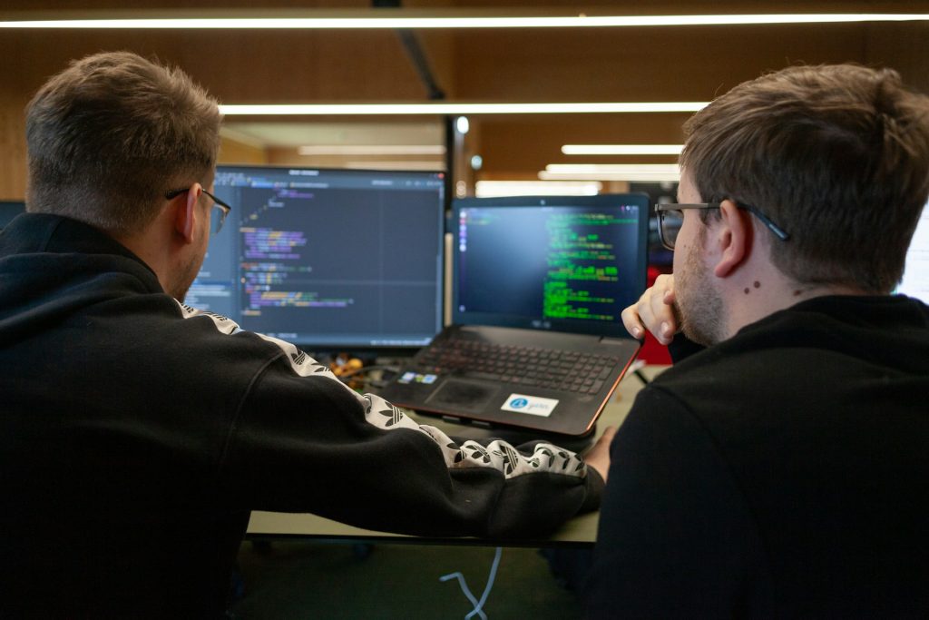 two software developers pair programming